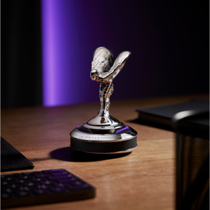 <p>Derived from a sculpture by Charles Sykes, commissioned by Henry Royce and present on every Rolls-Royce since 1911, the Spirit of Ecstasy is synonymous with the marque. Crafted from stainless steel using the traditional lost-wax casting process, this interpretation of the Spirit of Ecstasy now floats over a beautifully milled and polished base complete with a carbon fibre finish or Rolls-Royce Motor Cars natural grain leather. </p>