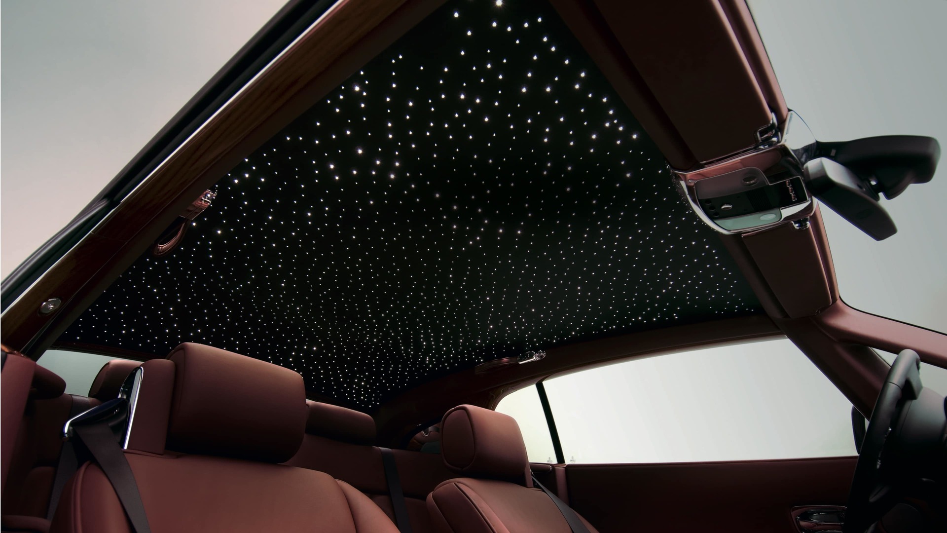 Interior of Rolls-Royce motor car with starlight headliner creating the illusion of a star-filled night sky