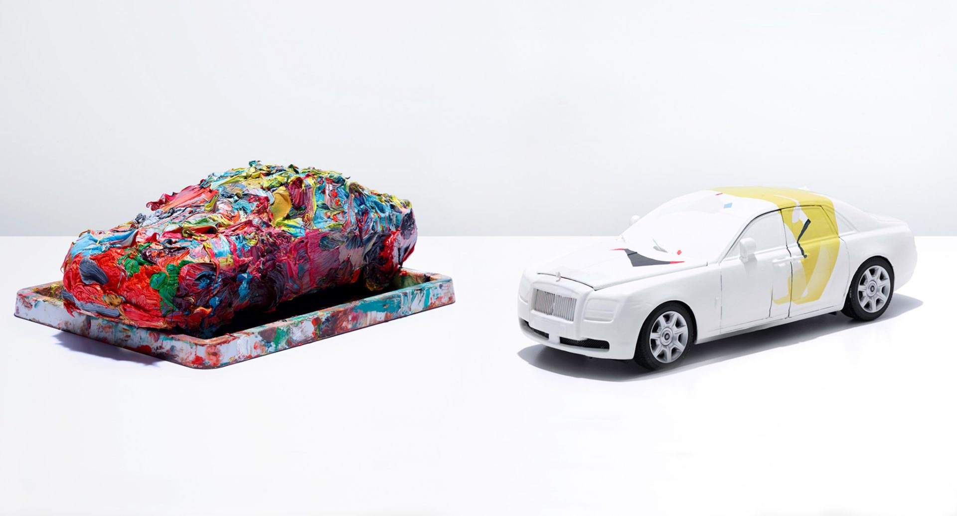Two painted miniature Rolls-Royce ghosts. Art pieces part of the Masterpieces in Miniature collaboration.