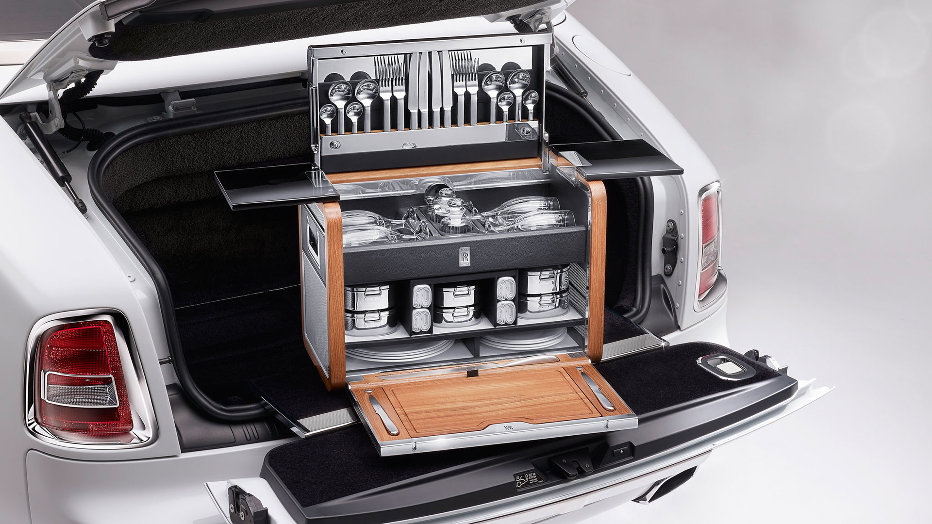 The Rolls-Royce Picnic Hamper in the boot of a light grey Rolls-Royce Phantom