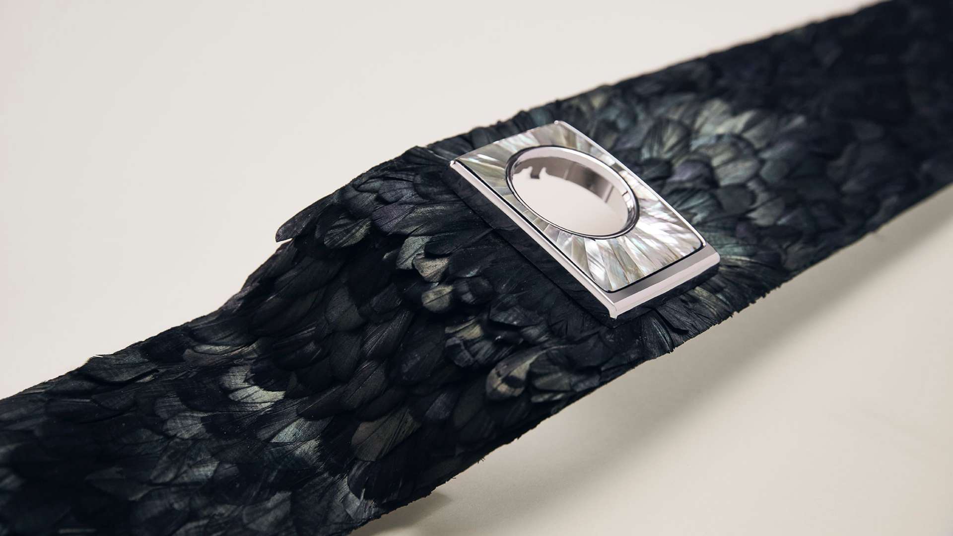 A bespoke artwork created by Swiss materials specialists Nature Squared. This close up shows the Gallery in the process of being made, with over 3,000 iridescent feathers.