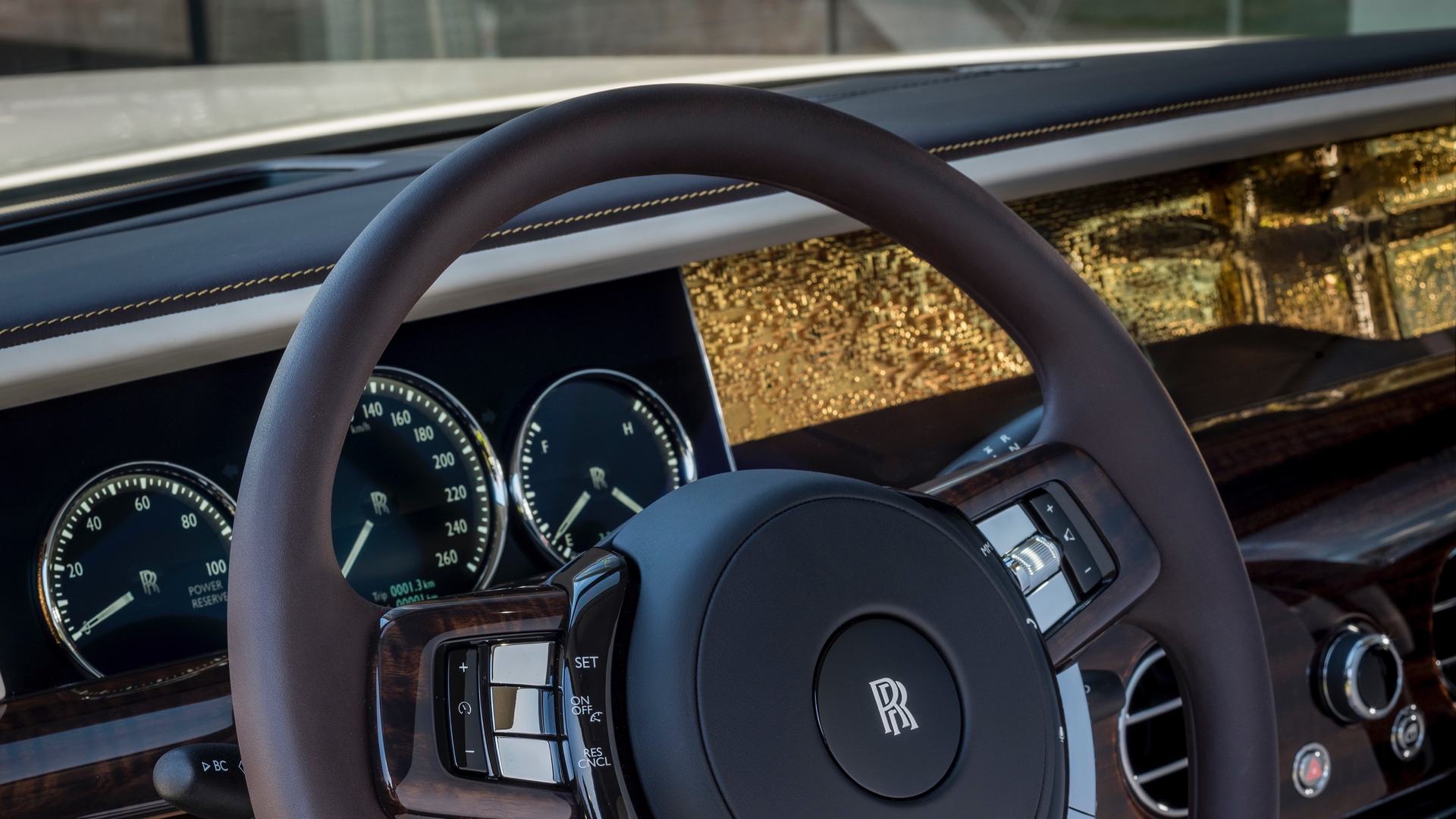 Close up of steering wheel from a Rolls-Royce smokey quartz Phantom
