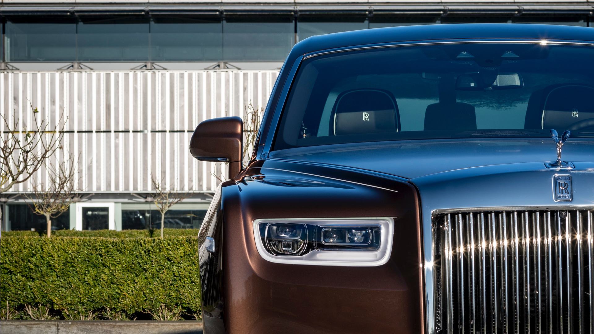Front exterior of a copper Rolls-Royce Phantom at the Goodwood factory.