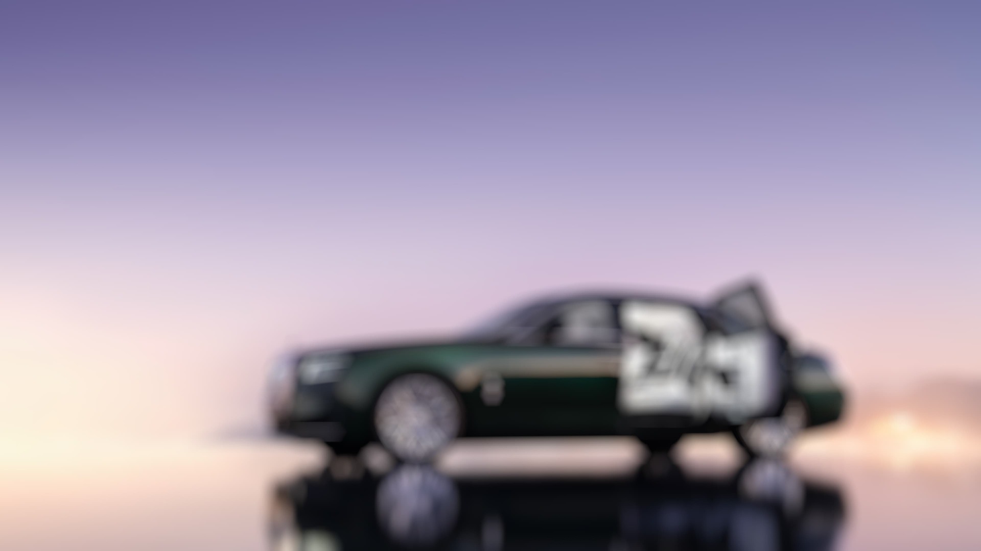 Side profile of Green Ghost Extended with rear doors open, car reflecting against the ground