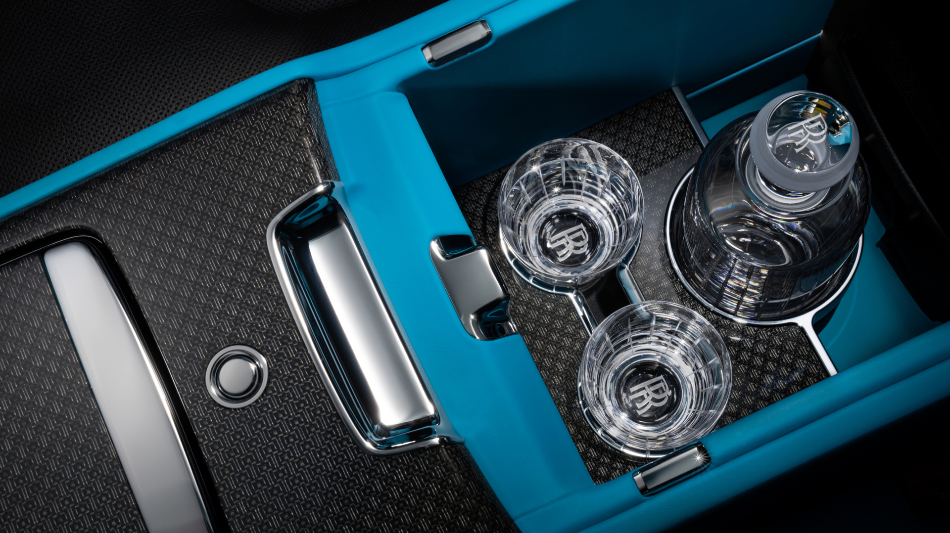 Passenger cupholder with by Rolls Royce themed glass and a bottle