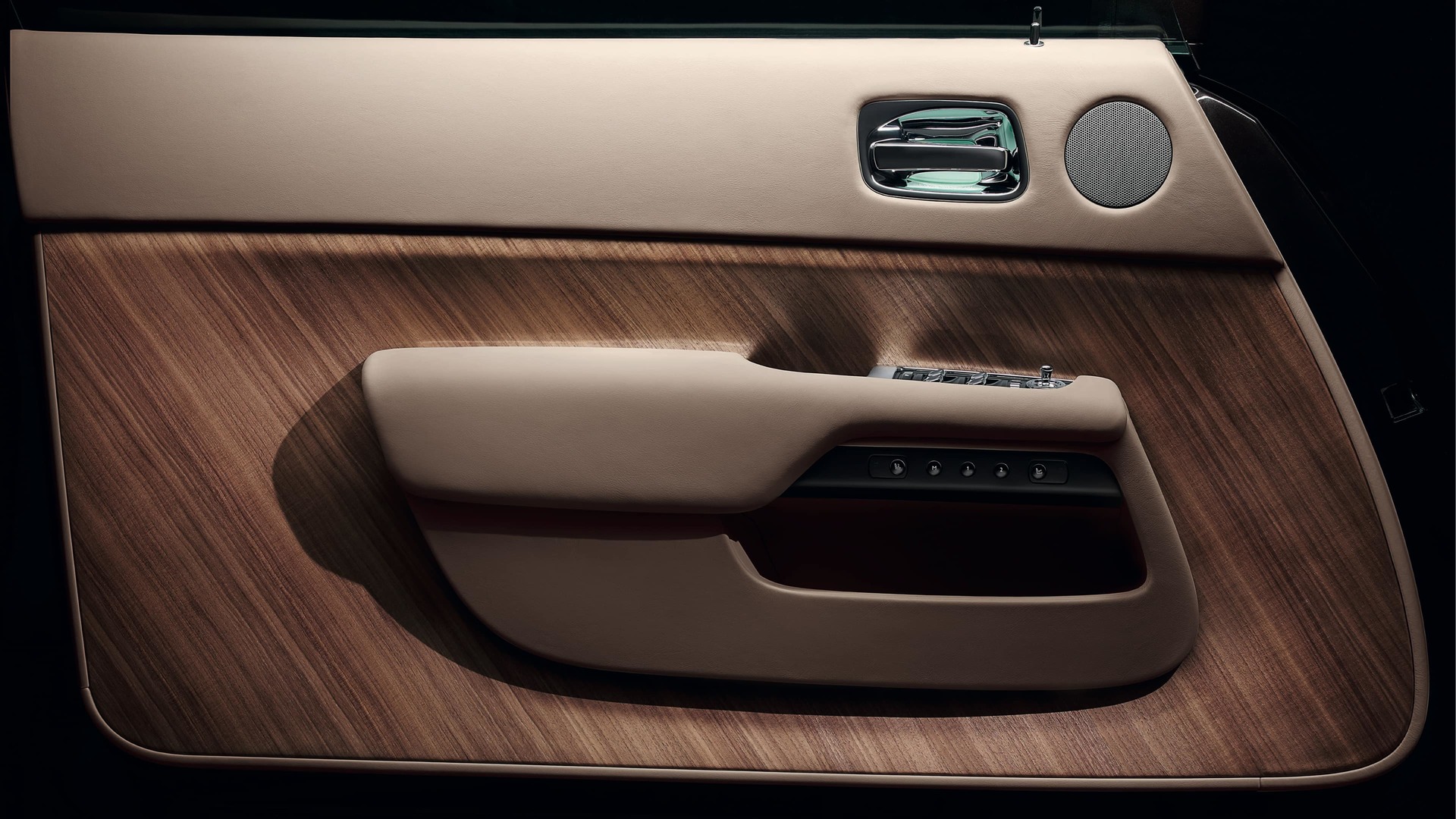 Canadel wood panelling curves to hug the contours of the coach doors in a Rolls-Royce motor car