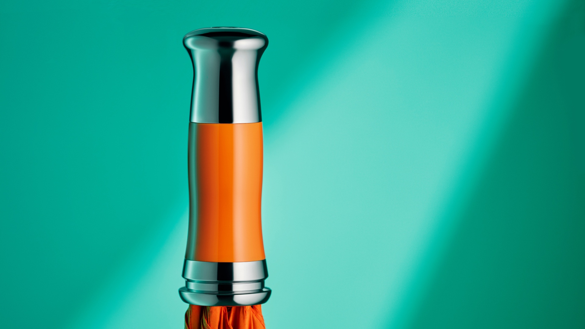 Detailed view of the polished Rolls-Royce Umbrella handle in mandarin colour