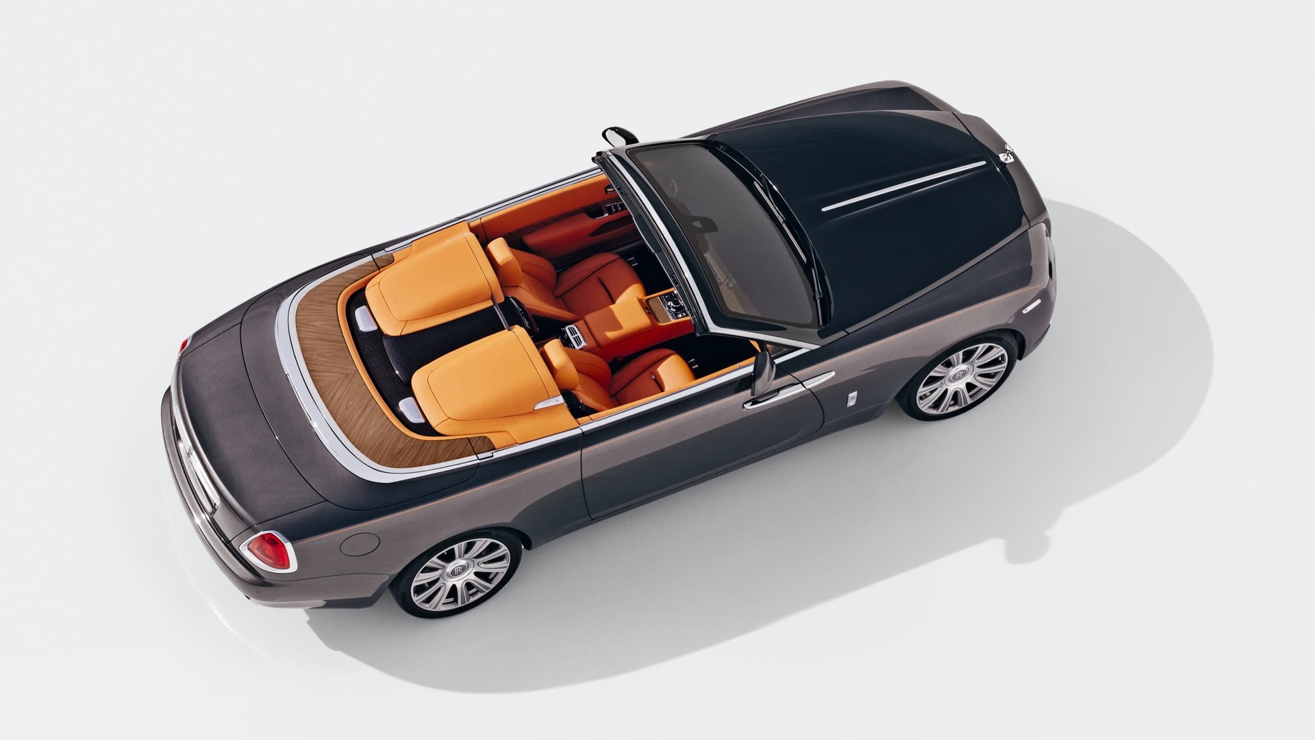 Aerial view of stationary Rolls-Royce Dawn motor car with Dawn Aero Cowling Tonneau Cover open