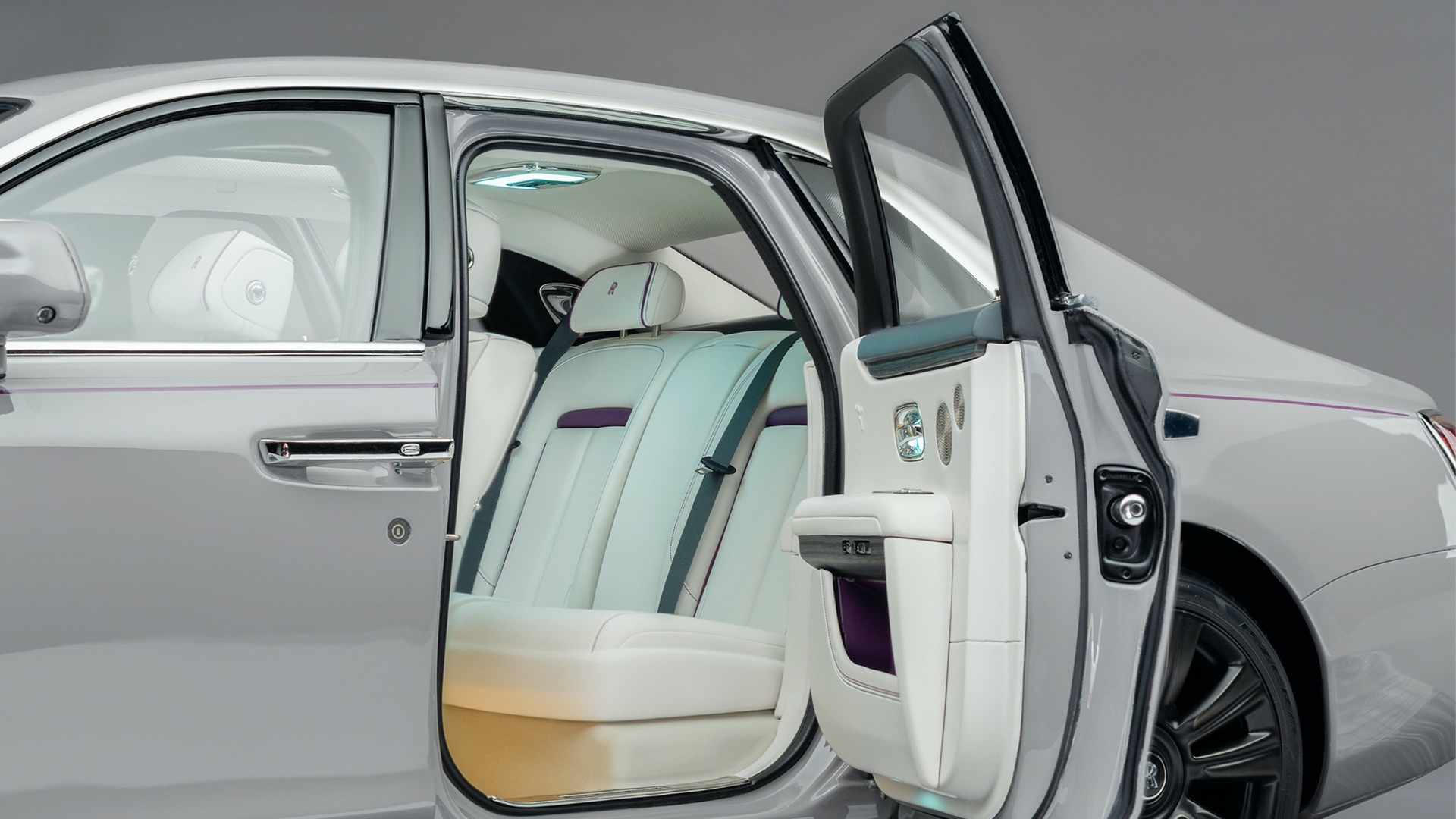 Rear cabin door open of 1:8 scale model of the Rolls-Royce Ghost motor car revealing interior seating and details