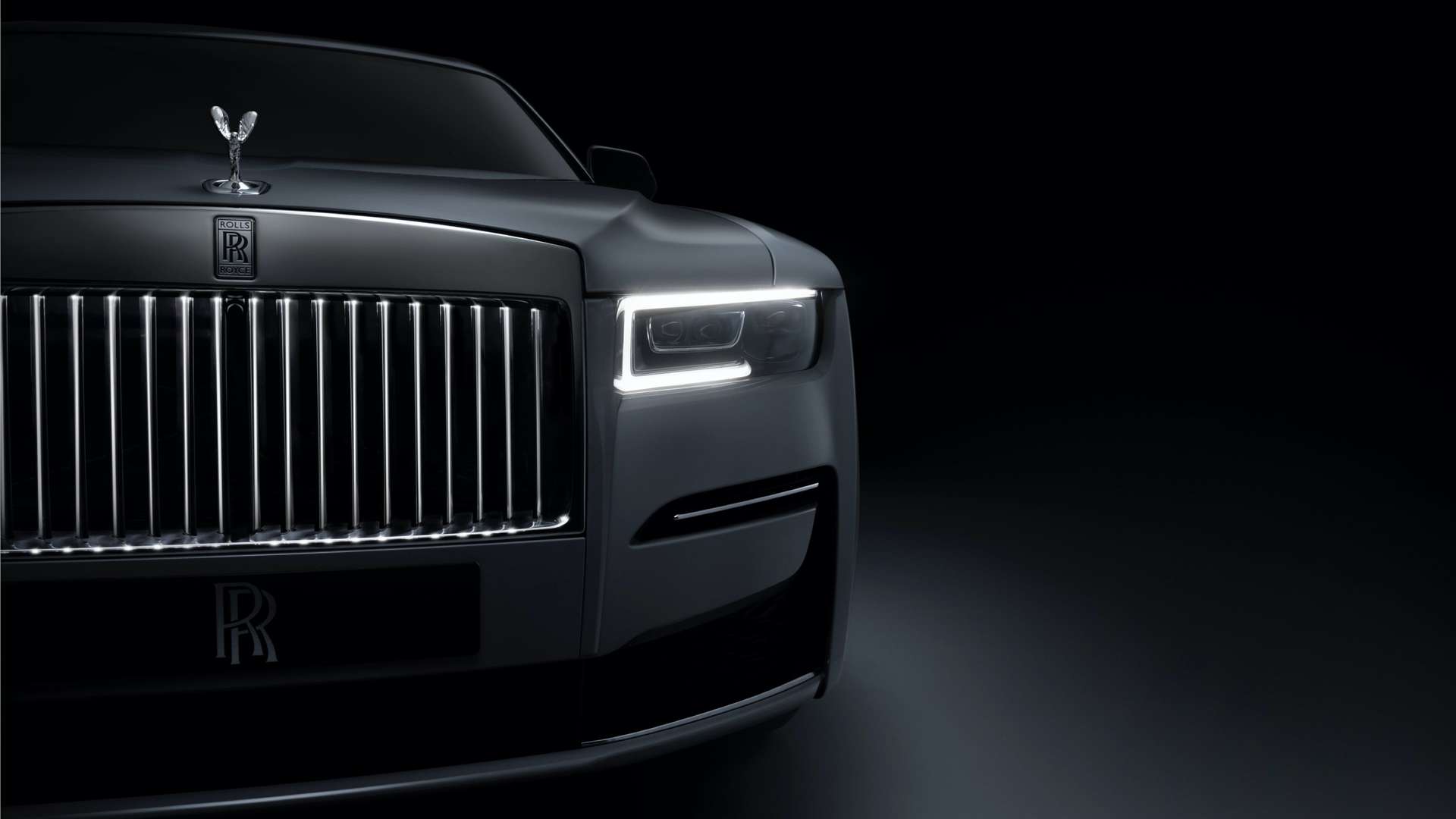 Close front view of Rolls-Royce motor car's illuminated grille