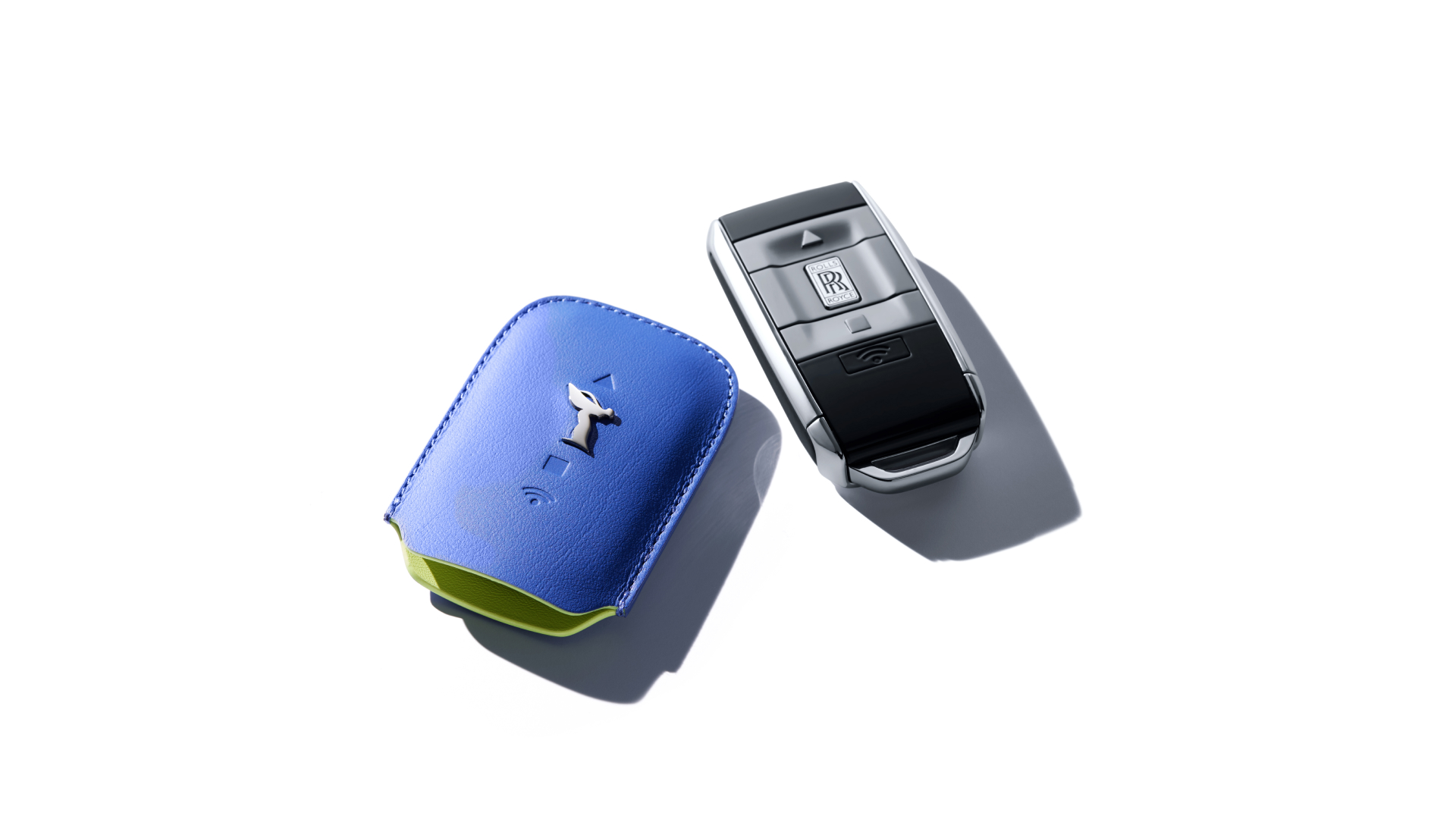 Rolls-Royce motor car key next to its key wrapper in Cobalto Blue and Lime Green