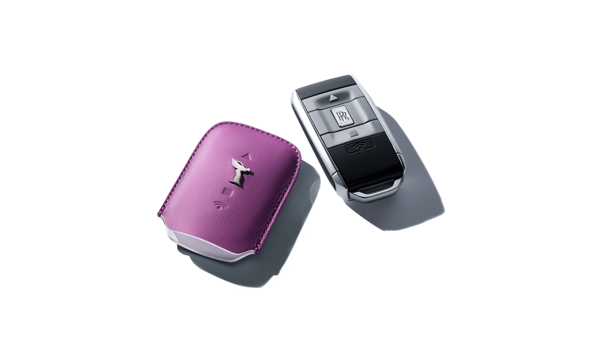 Rolls-Royce motor car key next to its key wrapper in Tailored Purple and Artic White
