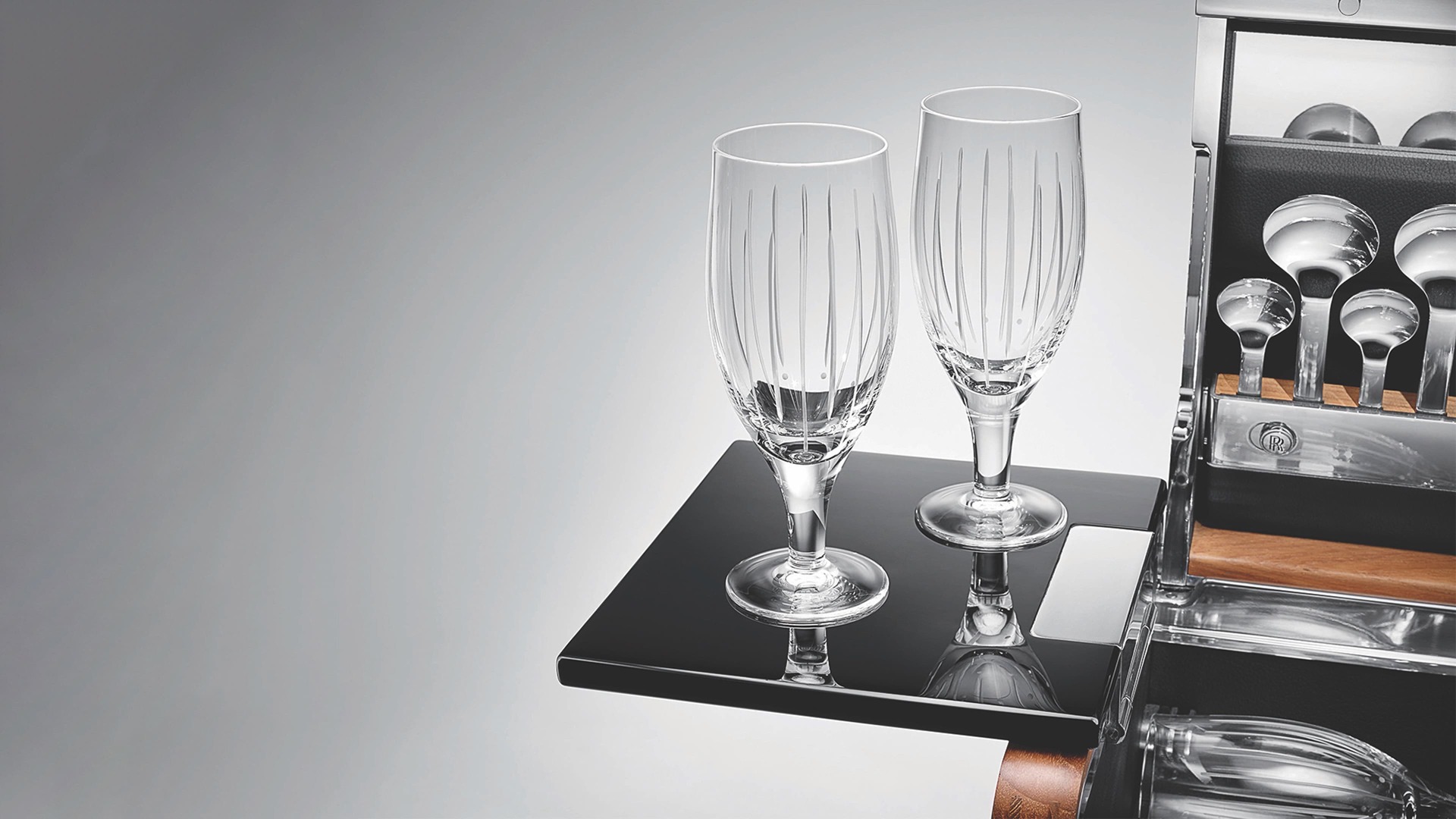 The handcrafted Rolls-Royce Picnic Hamper includes lead crystal wine glasses