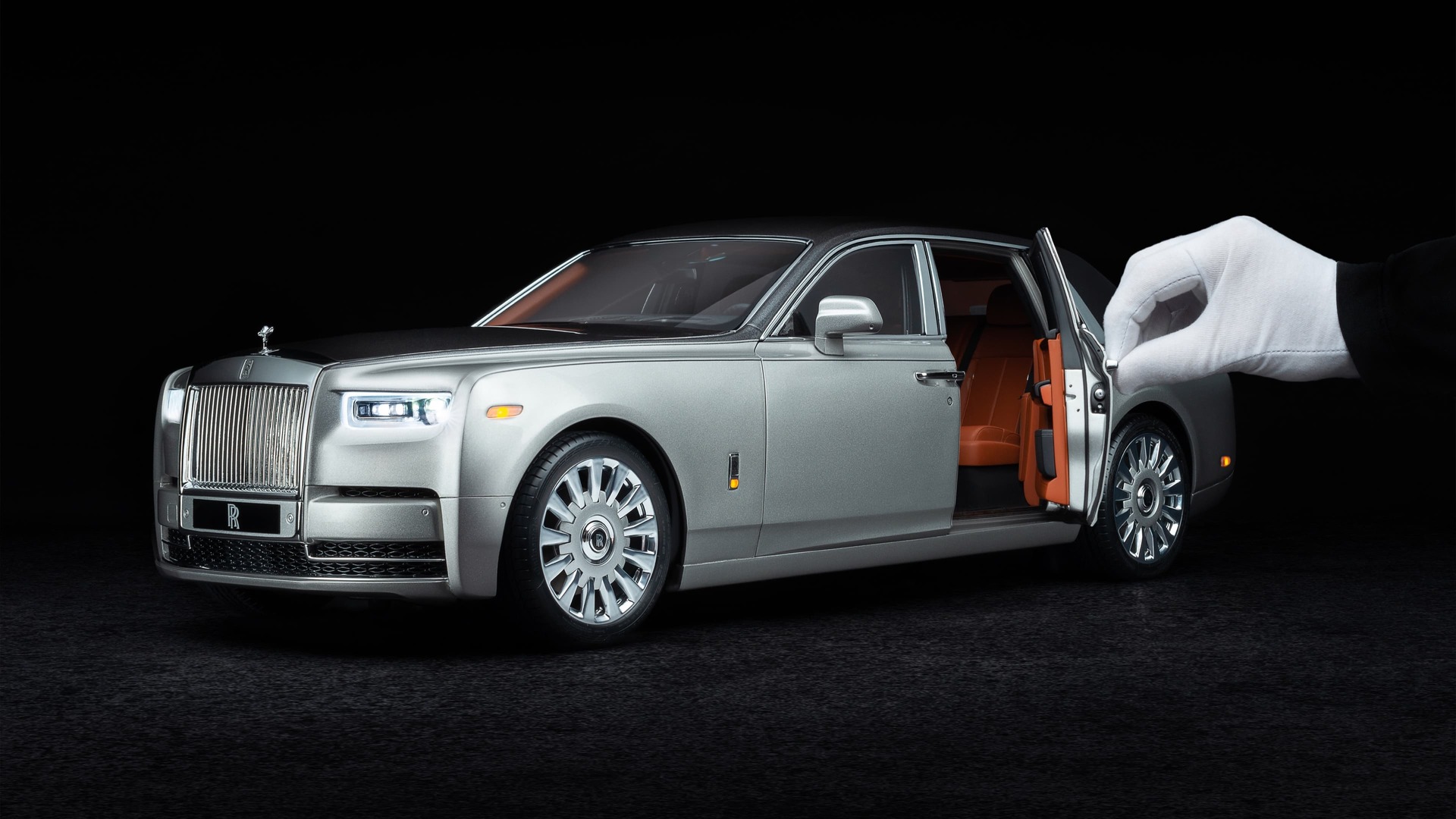 1:8 scale model of the Rolls-Royce Phantom motor car with hand holding door open