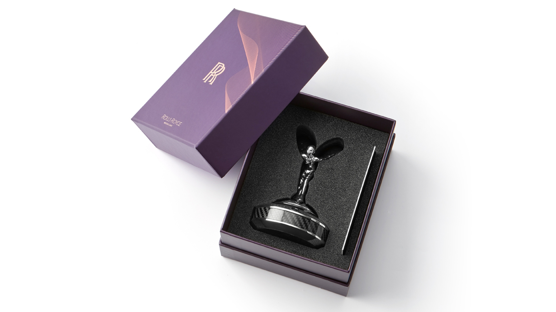 Spirit of Ecstasy on a plinth in its beautiful Rolls-Royce packaging
