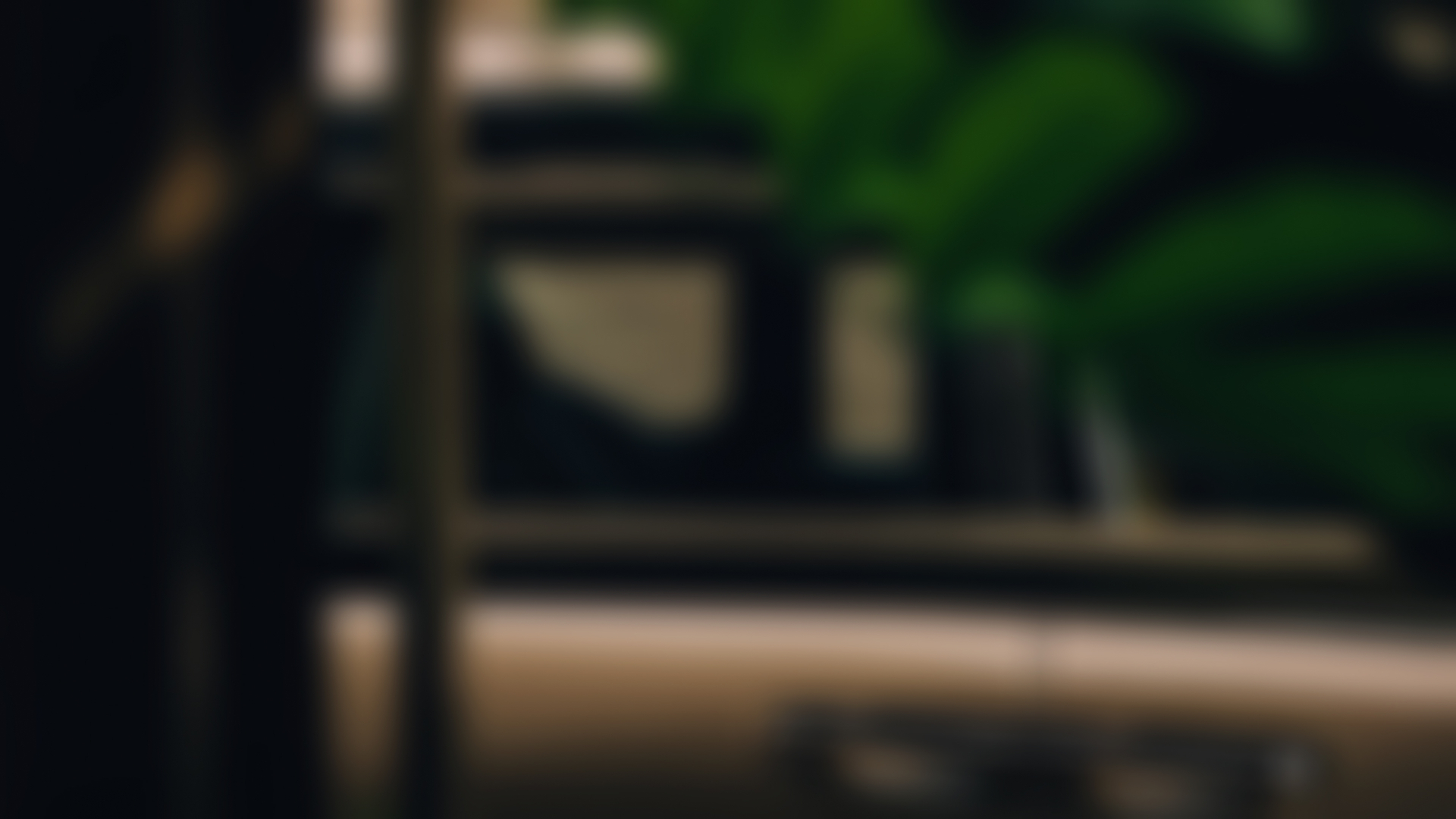 Side view of a Rolls-Royce Cullinan Series II throw a window