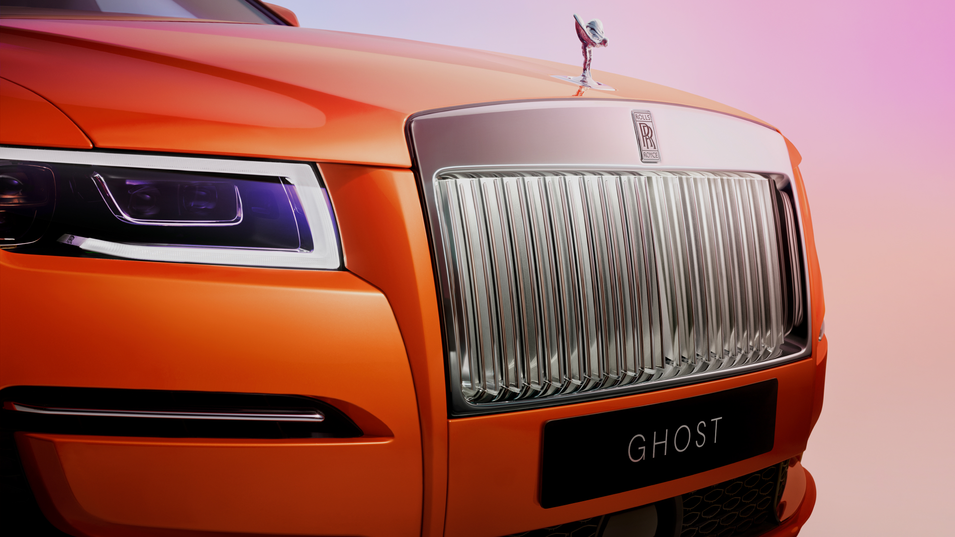 Front shot of Ghost displaying the SOE, well known Rolls Royce front grill and a number plate with Ghost written on it
