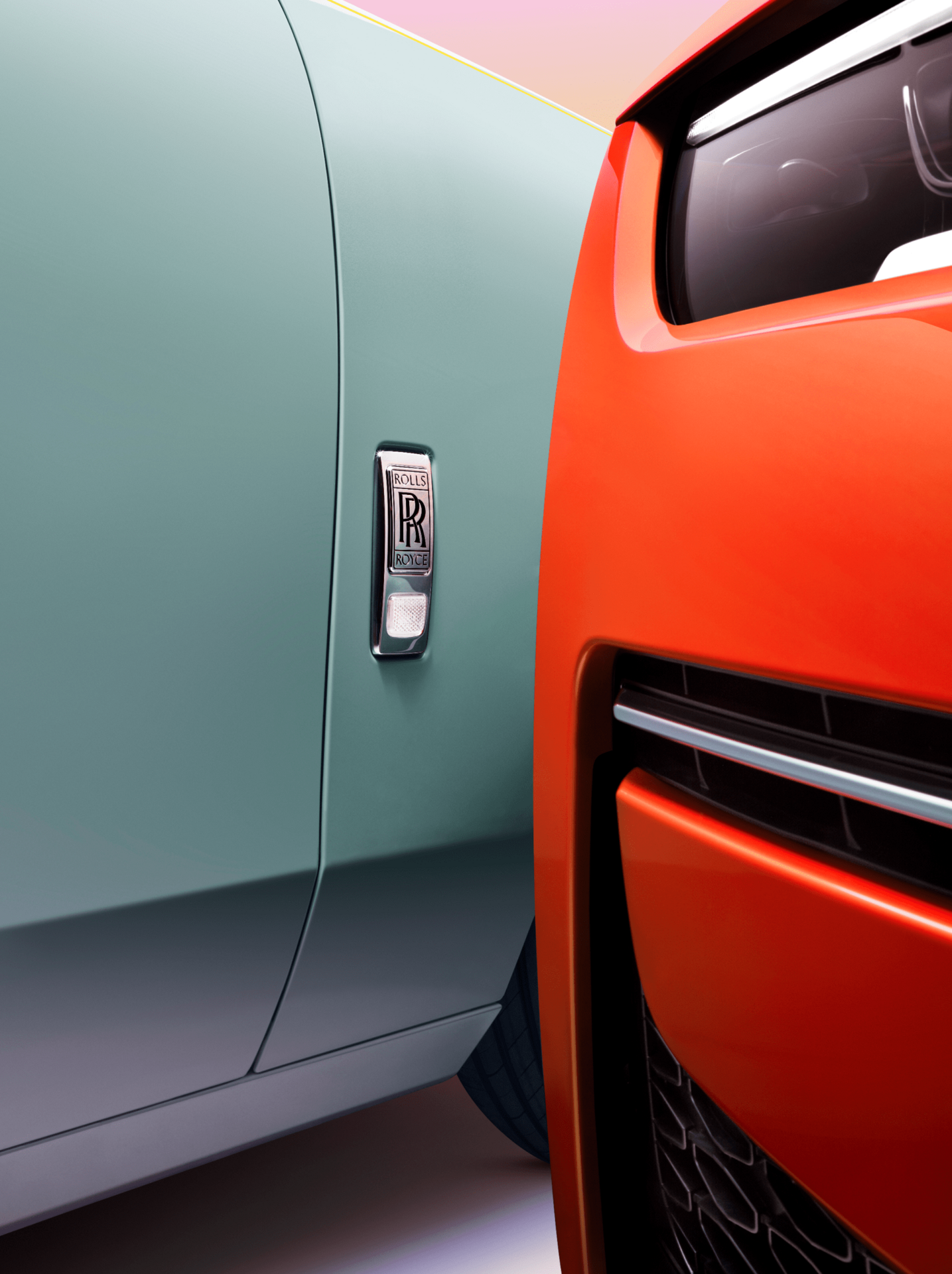 Close up of the side Duck Egg Blue Ghost and the front headlight of the Orange Metallic Ghost side by side