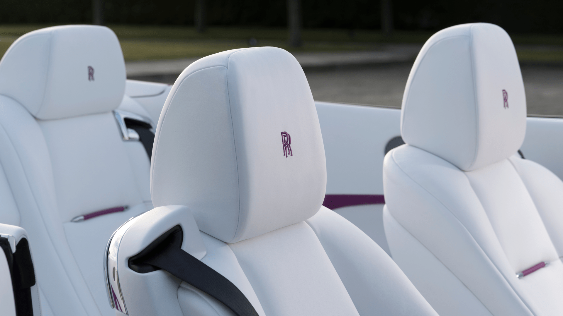 An image of 3 Rolls-Royce white car seats