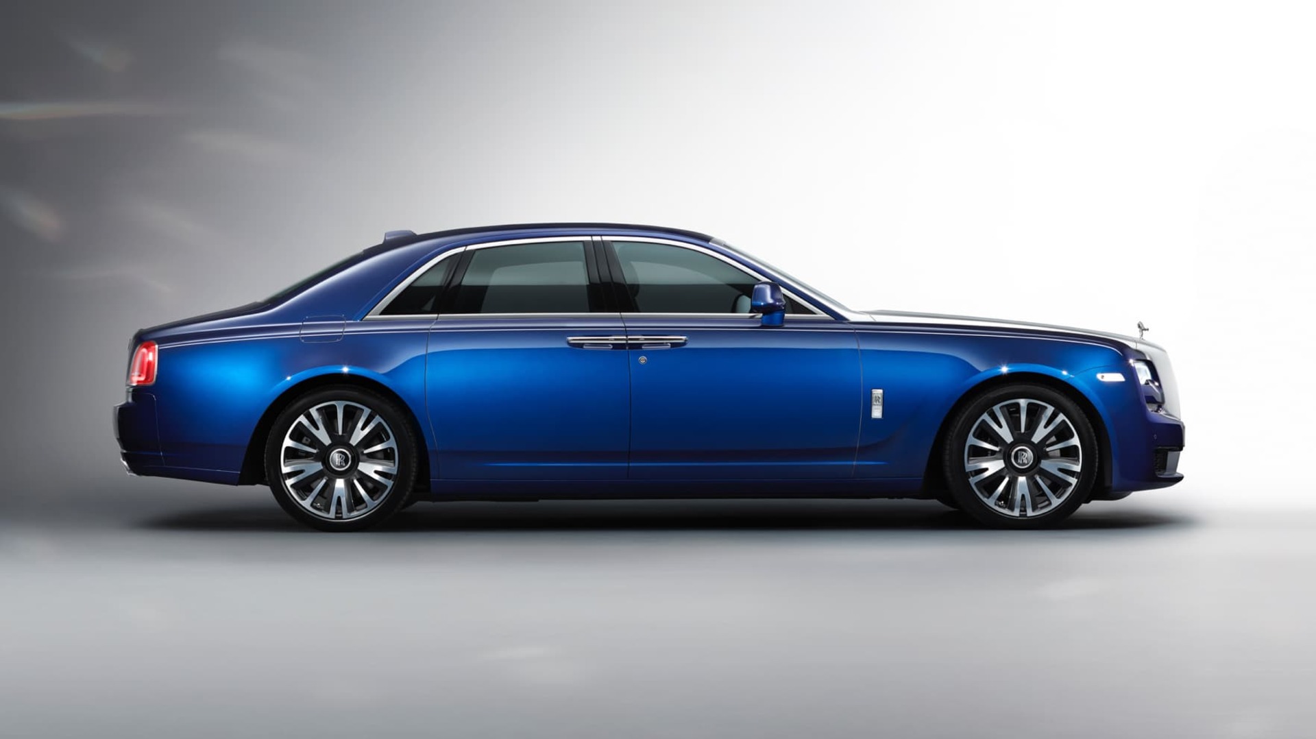 A side profile shot of a blue Rolls-Royce Ghost