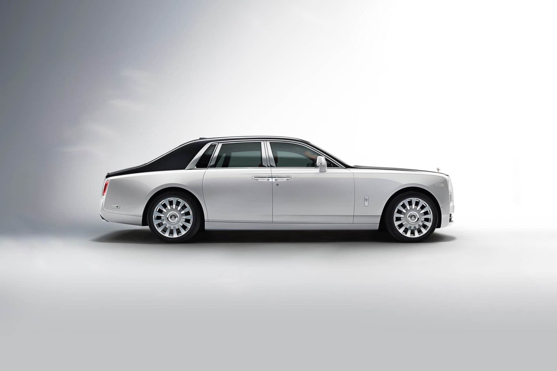 Side exterior of stationary bespoke Rolls-Royce Phantom motor car in showroom