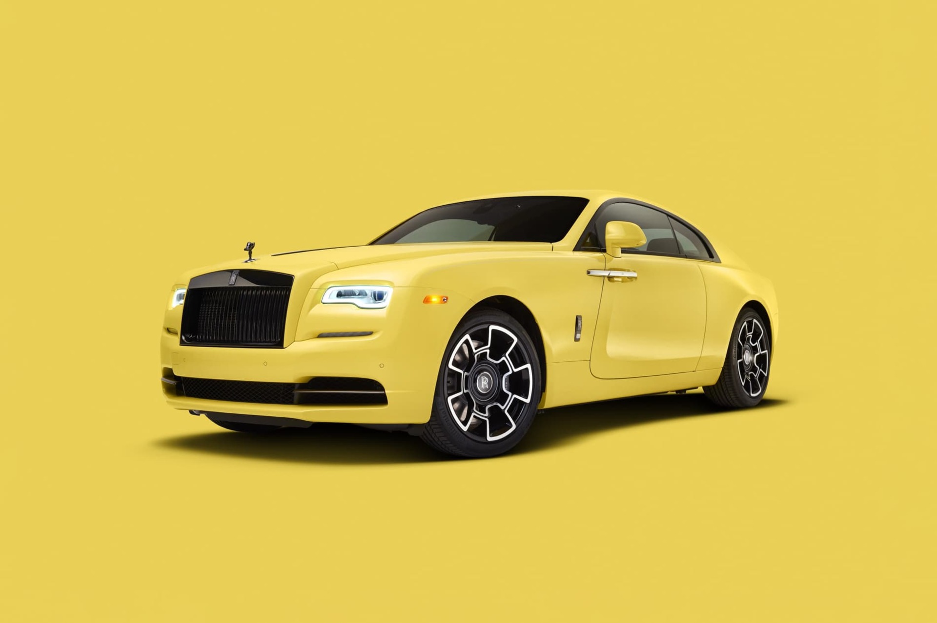 3/4 front exterior of stationary Rolls-Royce Wraith motor car in Semaphore Yellow from the Pebble Beach Pastel collection