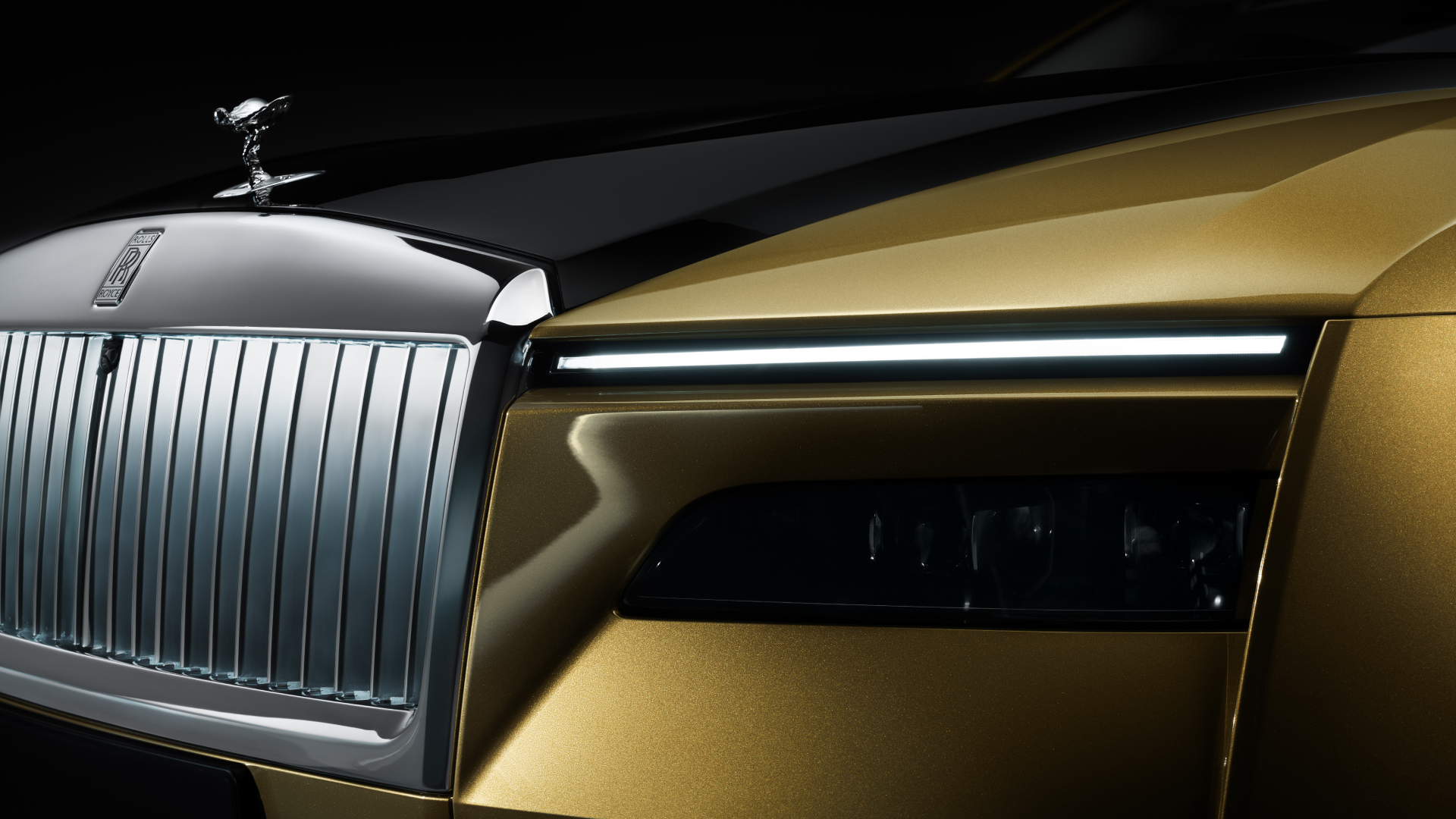 Front headlight of Spectre with Spirit of Ecstasy logo in the frame